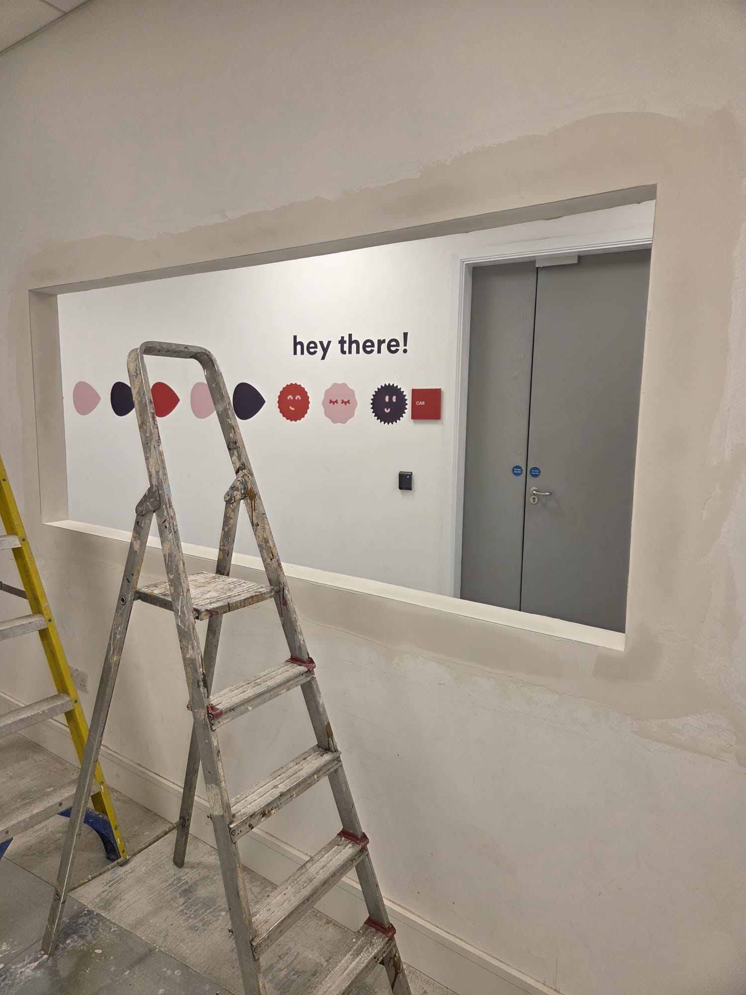 Smooth plaster finish on reception wall in Dublin office renovation by handyman