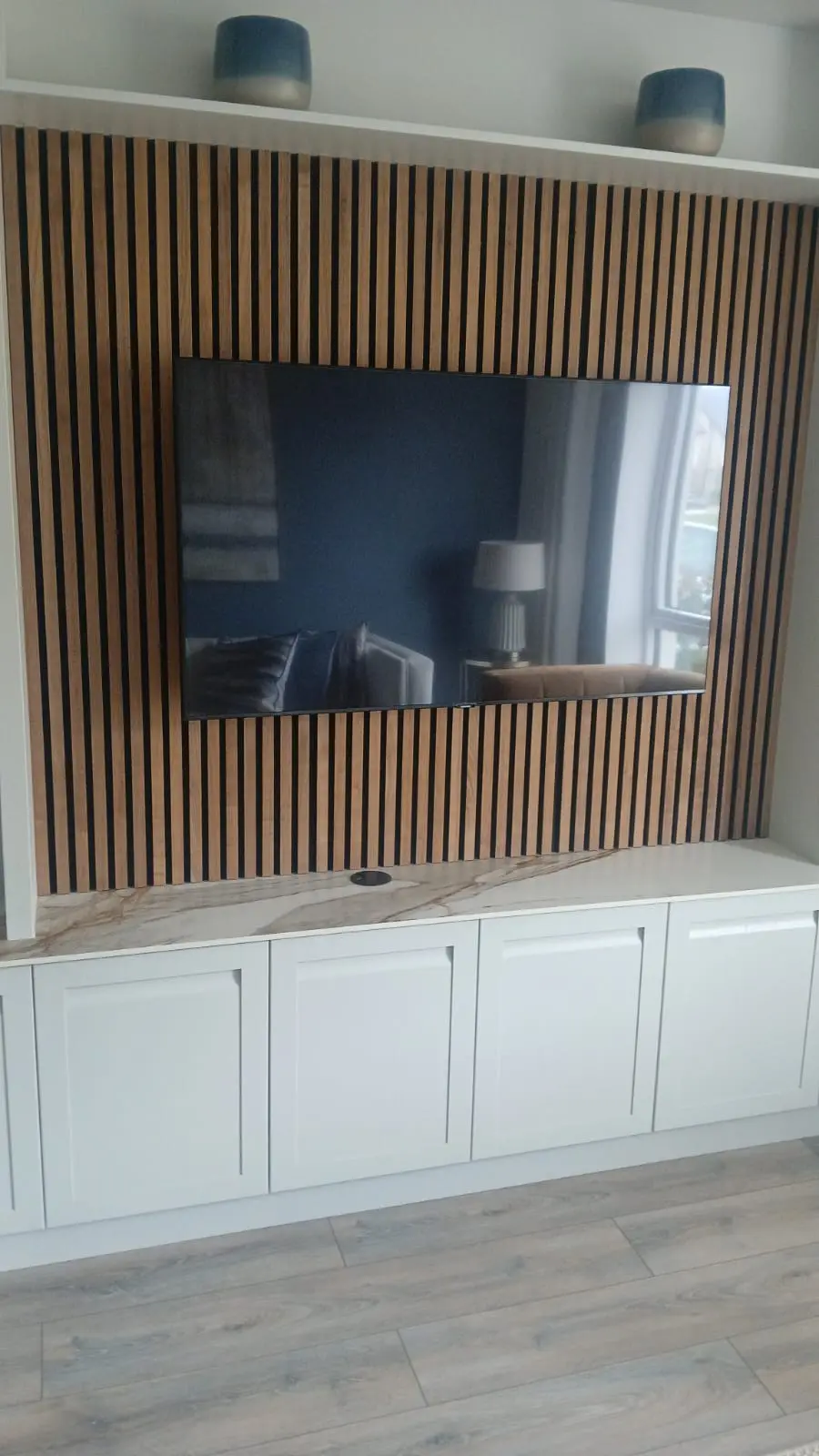 Professional TV wall mounting on white living room wall in Dublin home