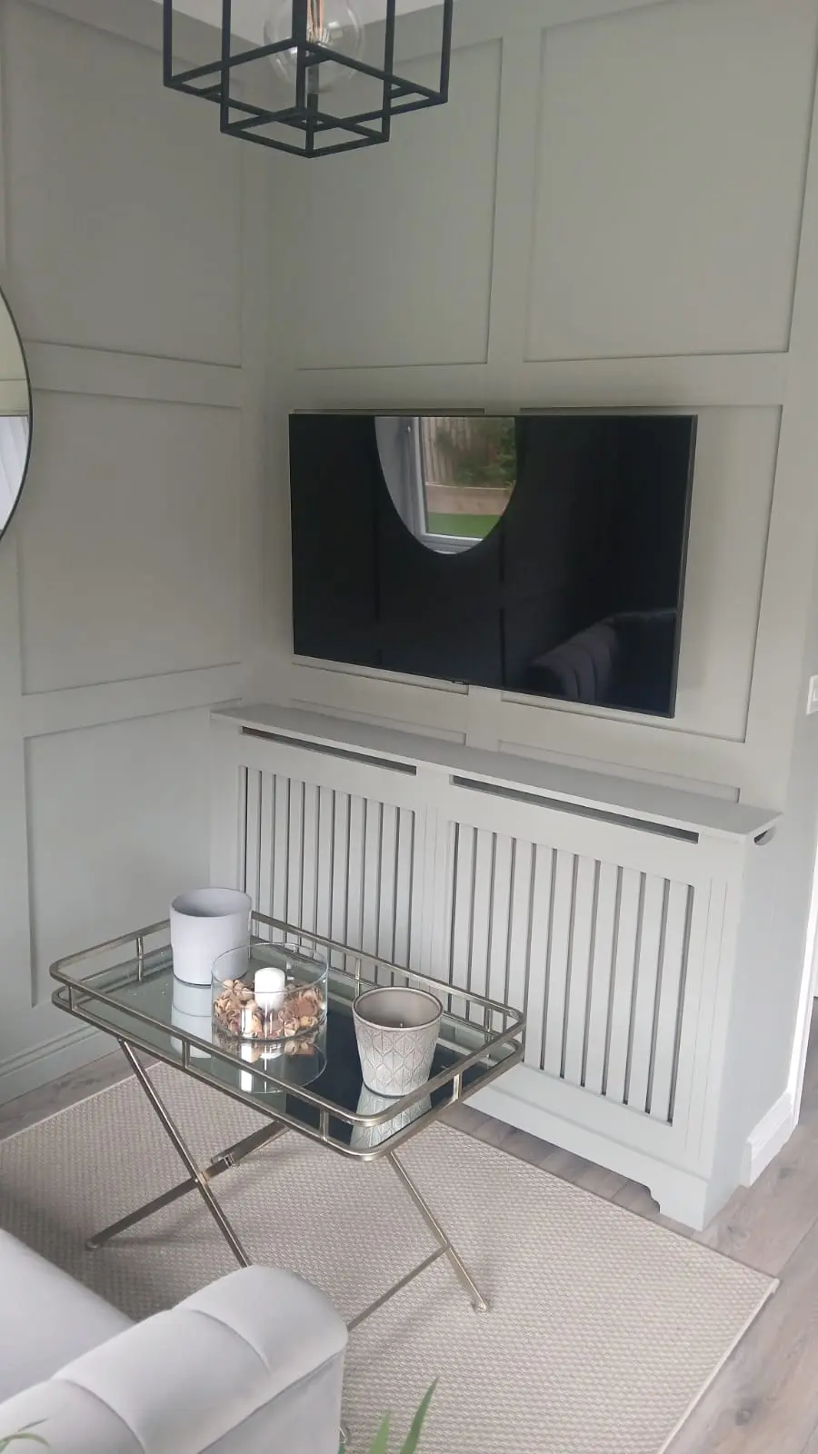 Flat screen TV mounted above fireplace with hidden cables in Kildare