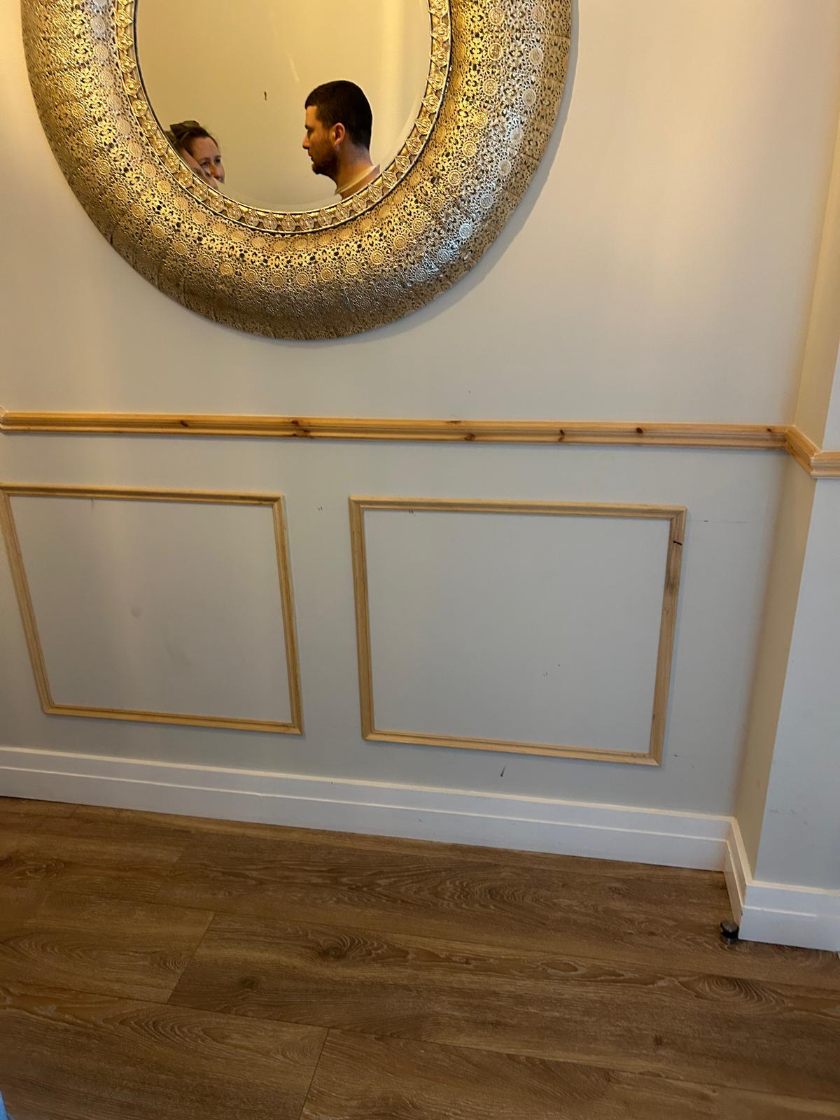 Decorative wall panelling with mirror surround in Dublin hallway