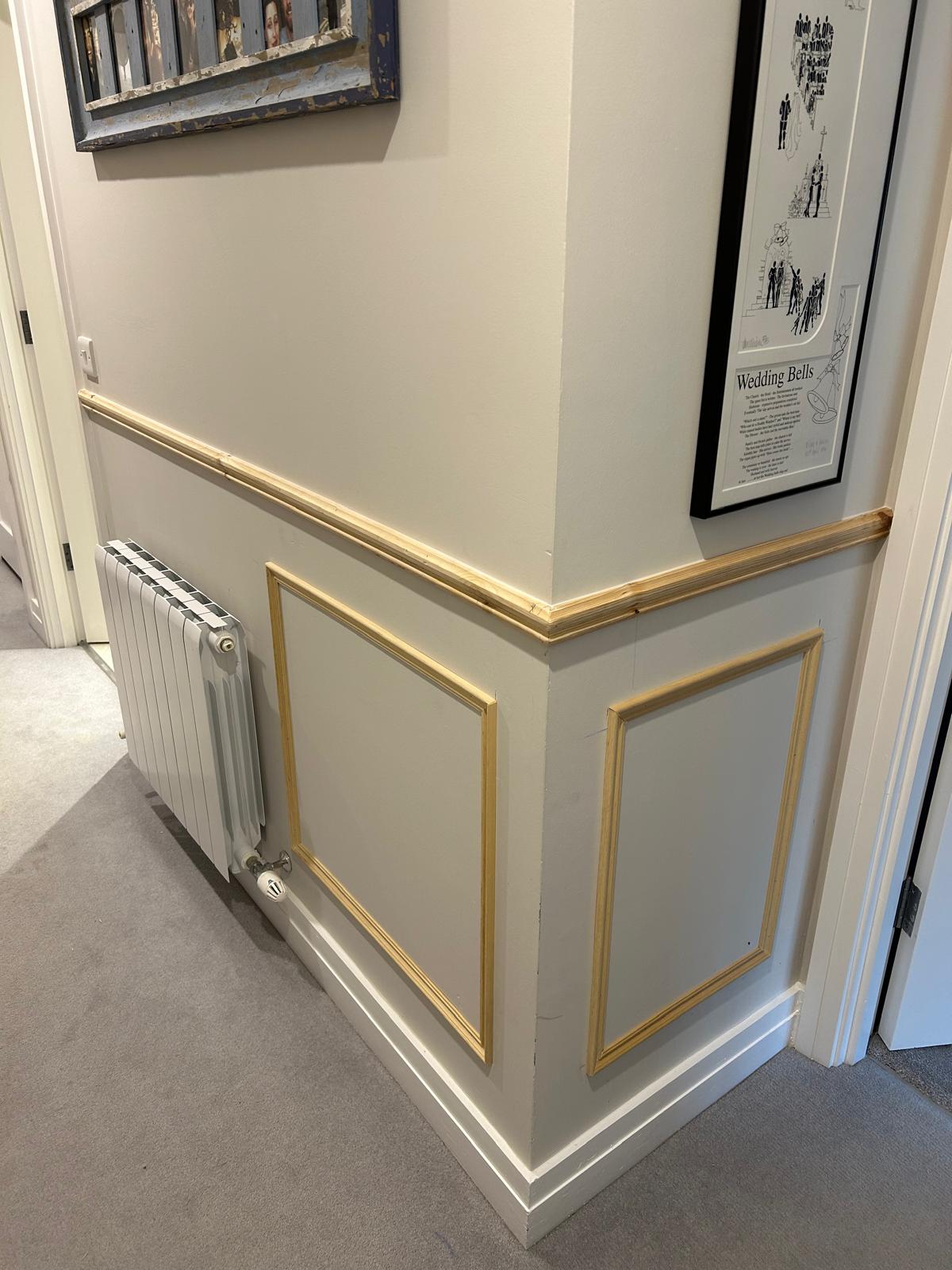 Wall panelling fitted around landing corner with clean finish